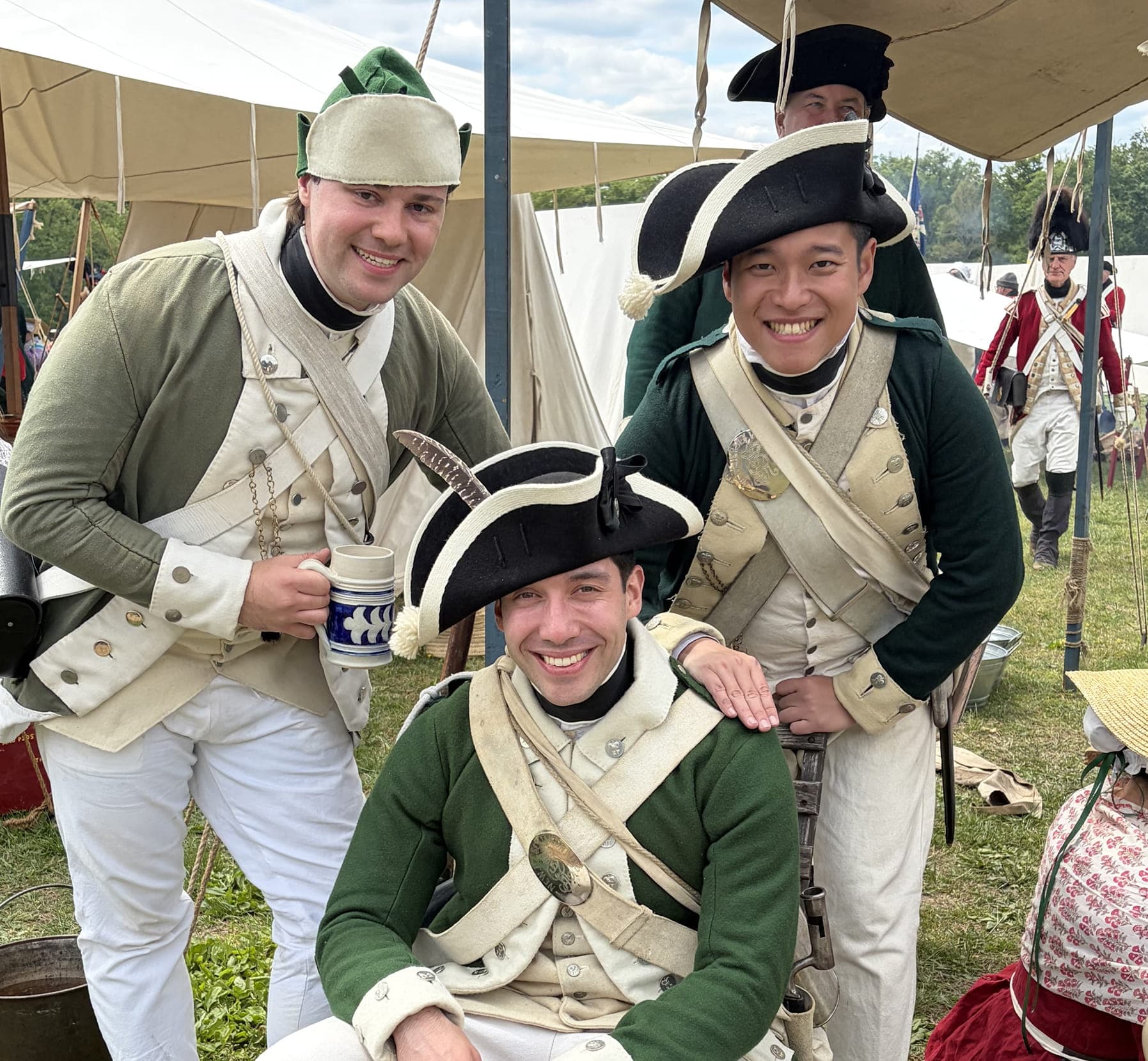 A group of reenactors pose for a photo.